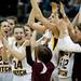 Manchester senior Taylor Manders celebrates with her team during the trophy presentation after defeating Saginaw Nouvel 57-52 on Saturday, March 16. Daniel Brenner I AnnArbor.com